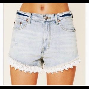 Free People denim Jean shorts with white lace trim